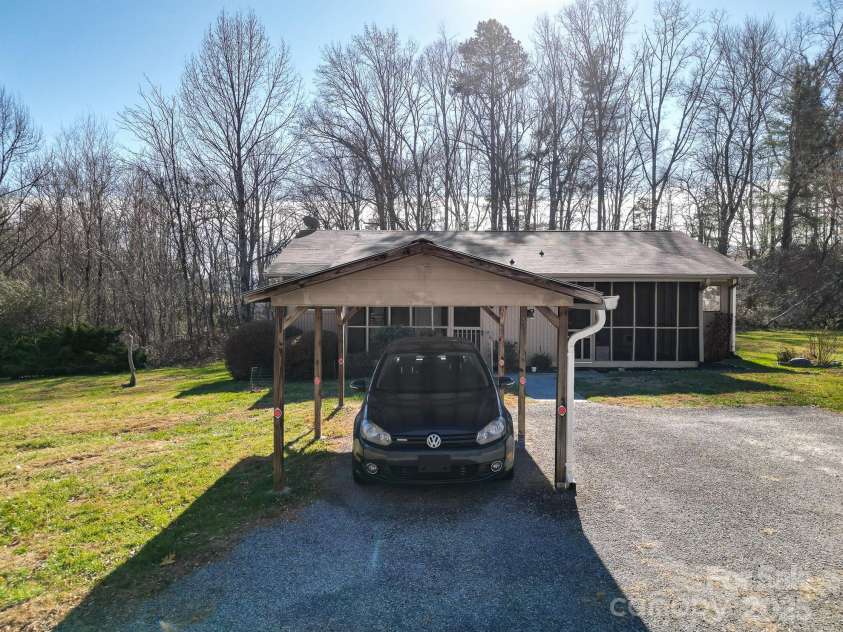 125 Freedom Road, Hendersonville, NC 28792.  MLS# CAR4329667, YatesRealty ID 2418. Carport belongs to unit!
