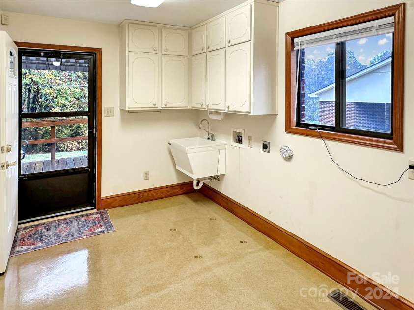 8031 George Hildebran School Road, Connelly Springs, NC 28612.  MLS# CAR4198034, YatesRealty ID 2418. Main Level Laundry room with utility sink