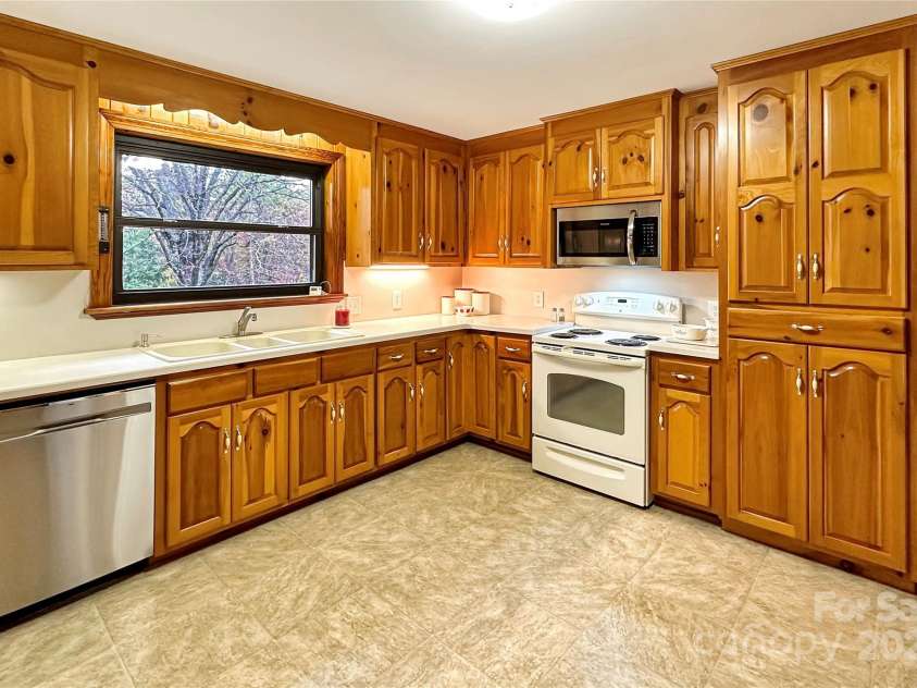 8031 George Hildebran School Road, Connelly Springs, NC 28612.  MLS# CAR4198034, YatesRealty ID 2418. Open concept den and eat-in kitchen