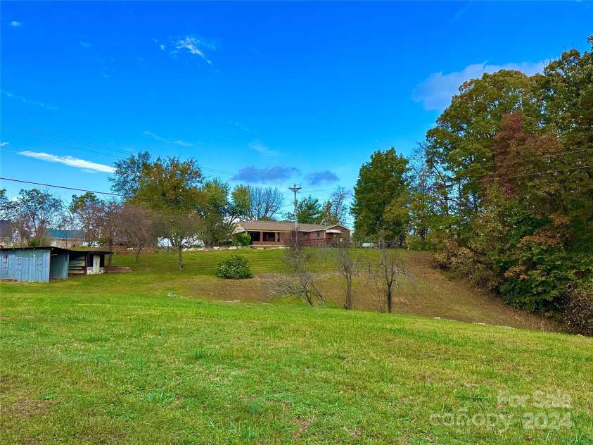 8031 George Hildebran School Road, Connelly Springs, NC 28612.  MLS# CAR4198034, YatesRealty ID 2418. Rolling acreage and storage building