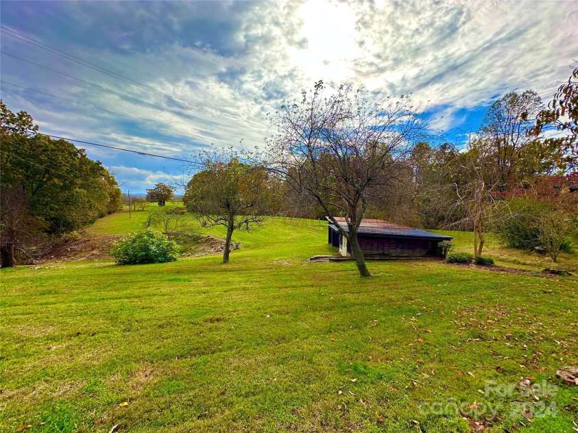 8031 George Hildebran School Road, Connelly Springs, NC 28612.  MLS# CAR4198034, YatesRealty ID 2418. View from back yard across the gorgeous acreage with long range mountain views