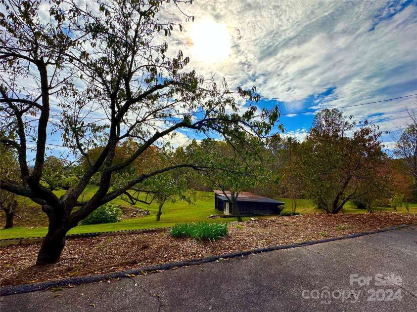 8031 George Hildebran School Road, Connelly Springs, NC 28612.  MLS# CAR4198034, YatesRealty ID 2418. View from back yard across the gorgeous acreage with long range mountain views