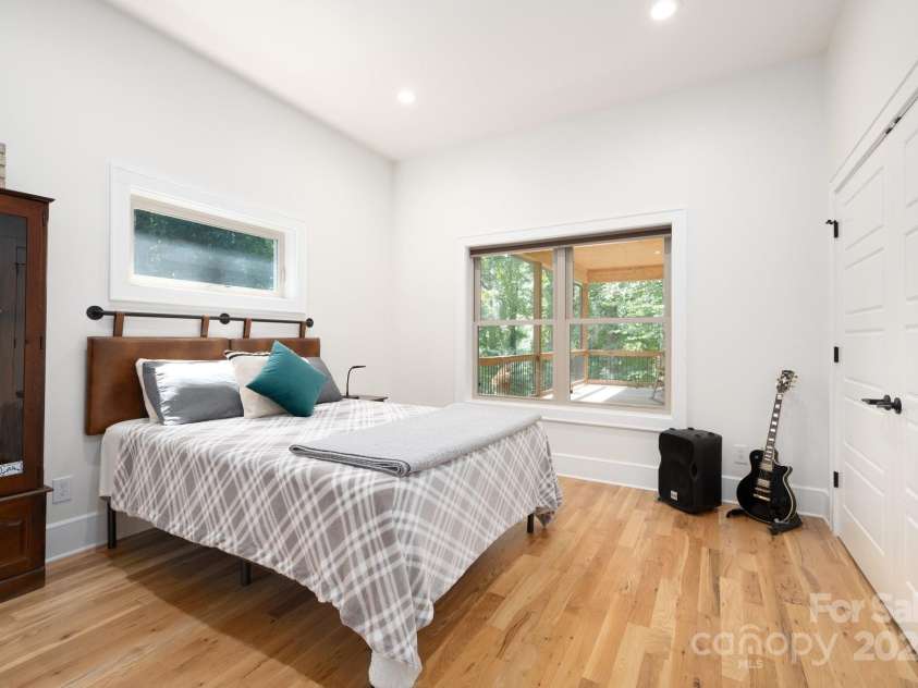 628 Brush Creek Road, Fairview, NC 28730.  MLS# CAR4256769, YatesRealty ID 24181. Bedroom 3 overlooks the covered front porch