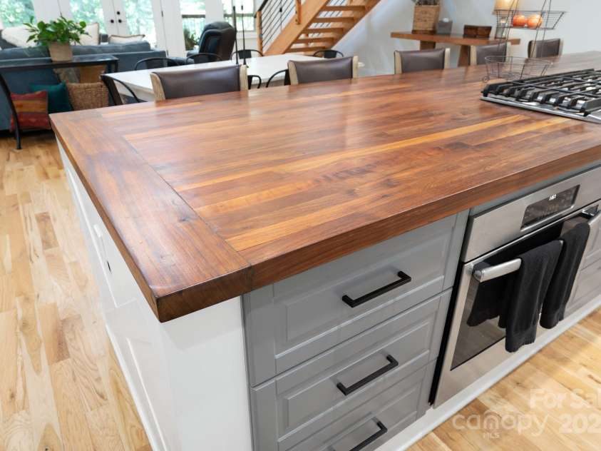 628 Brush Creek Road, Fairview, NC 28730.  MLS# CAR4256769, YatesRealty ID 24181. Check out this amazing 13'x4' custom walnut island!