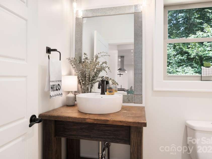 628 Brush Creek Road, Fairview, NC 28730.  MLS# CAR4256769, YatesRealty ID 24181. Custom vanity in the half bathroom