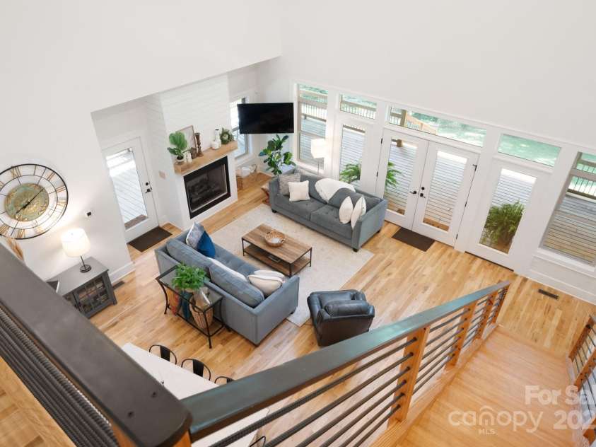 628 Brush Creek Road, Fairview, NC 28730.  MLS# CAR4256769, YatesRealty ID 24181. Loft overlooking the open floor plan and covered front porch