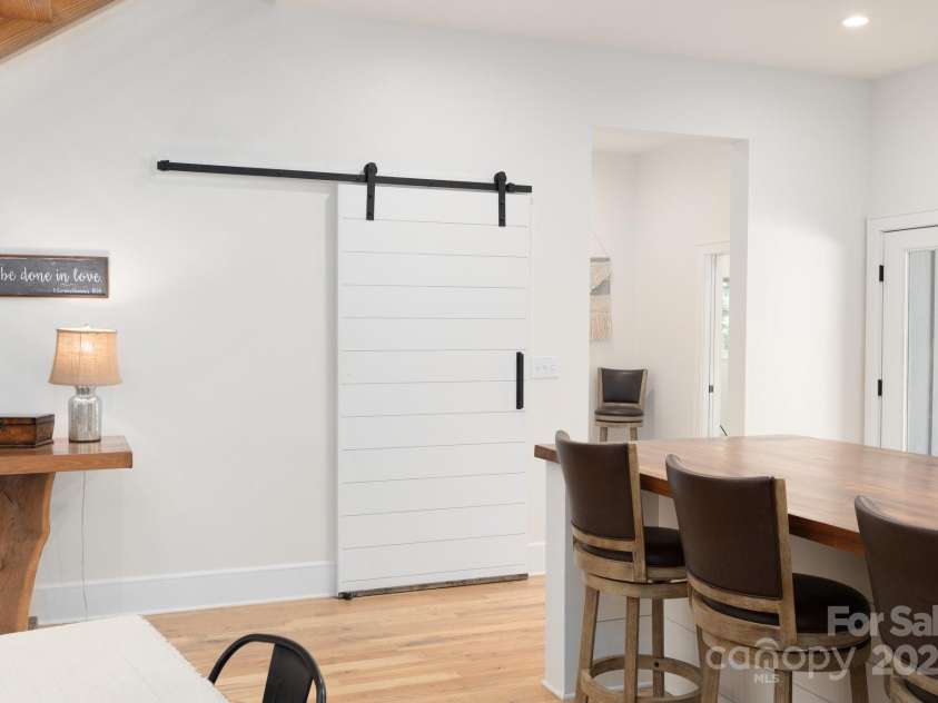 628 Brush Creek Road, Fairview, NC 28730.  MLS# CAR4256769, YatesRealty ID 24181. One of two pantries with custom sliding barn doors