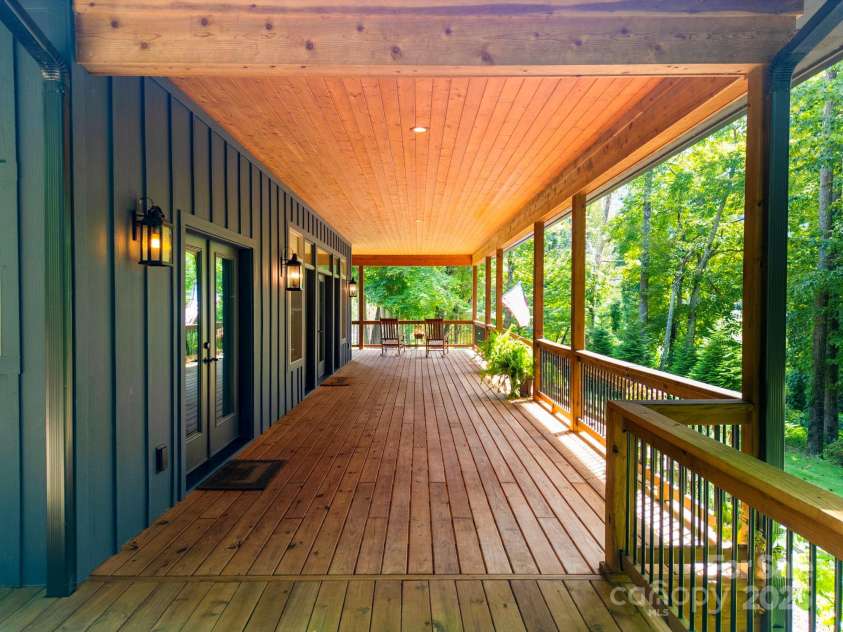 628 Brush Creek Road, Fairview, NC 28730.  MLS# CAR4256769, YatesRealty ID 24181. Over 1300 sq ft of relaxing covered porch space