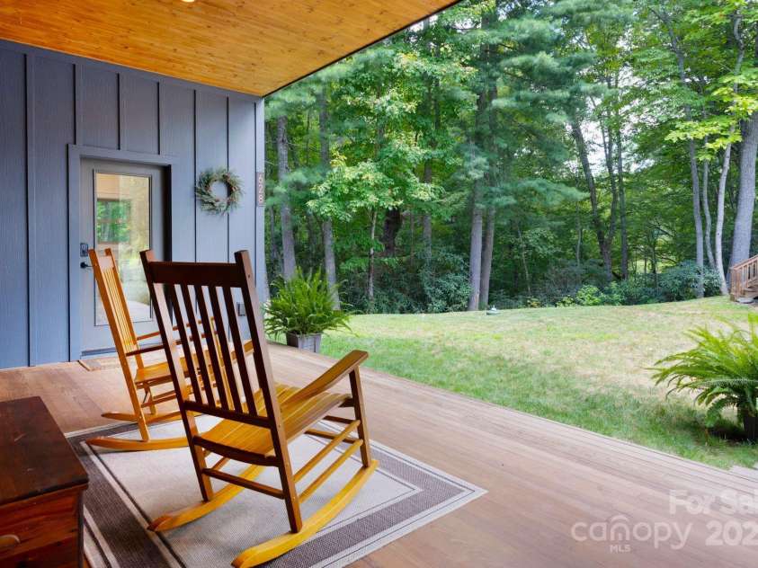 628 Brush Creek Road, Fairview, NC 28730.  MLS# CAR4256769, YatesRealty ID 24181. Private back yard with stream and pond just below the home and through the trees