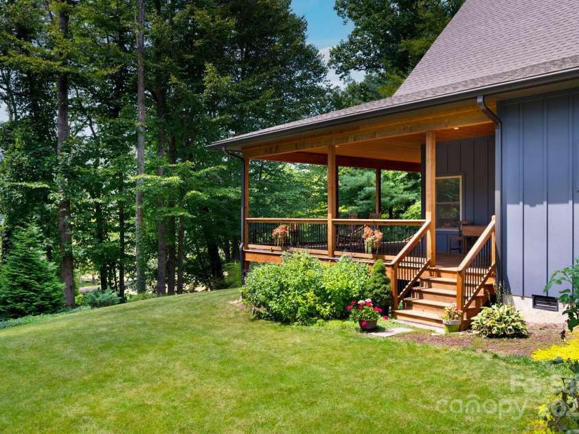 628 Brush Creek Road, Fairview, NC 28730.  MLS# CAR4256769, YatesRealty ID 24181. Side entrance to the wraparound front porch