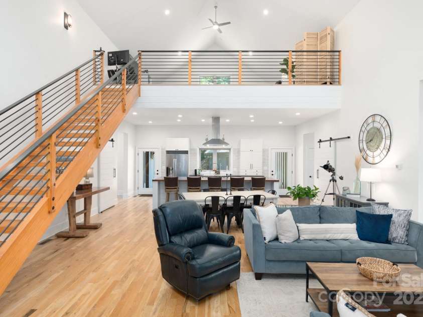 628 Brush Creek Road, Fairview, NC 28730.  MLS# CAR4256769, YatesRealty ID 24181. Stunning open living space features 27' vaulted ceilings