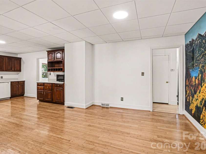 955 Hickory Nut Street, Charlotte, NC 28205.  MLS# CAR4372361, YatesRealty ID 24185. Kitchen has a very large eat in dining area- the wall on right has a painted mural ( not wallpaper)