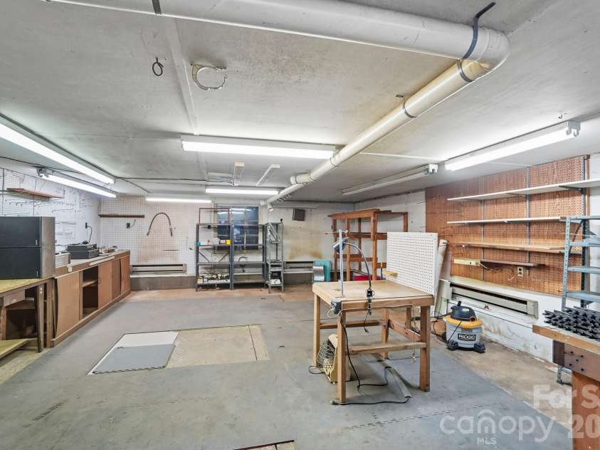 955 Hickory Nut Street, Charlotte, NC 28205.  MLS# CAR4372361, YatesRealty ID 24185. This workshop is over 800 square feet!  This area has endless possibilities and could be finished for an ADU, He/She shed, art studio or large gameroom.  Make it yours!
