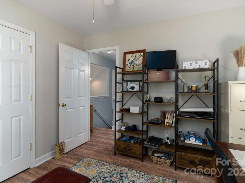 819 Northeast Drive, Davidson, NC 28036.  MLS# CAR4276218, YatesRealty ID 24193. Bedroom 2 with laminate flooring and ceiling fan.