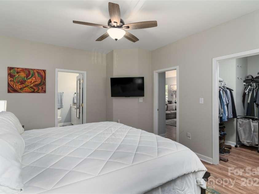 819 Northeast Drive, Davidson, NC 28036.  MLS# CAR4276218, YatesRealty ID 24193. Primary suite with low maintenance flooring and ceiling fan.