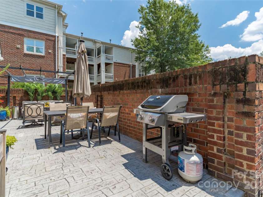 819 Northeast Drive, Davidson, NC 28036.  MLS# CAR4276218, YatesRealty ID 24193. Privacy walls surround your patio,