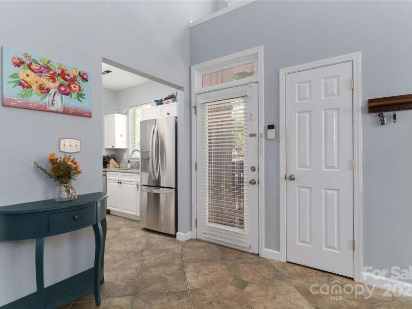 819 Northeast Drive, Davidson, NC 28036.  MLS# CAR4276218, YatesRealty ID 24193. Spacious Entry Hall with transom over the glass front door.