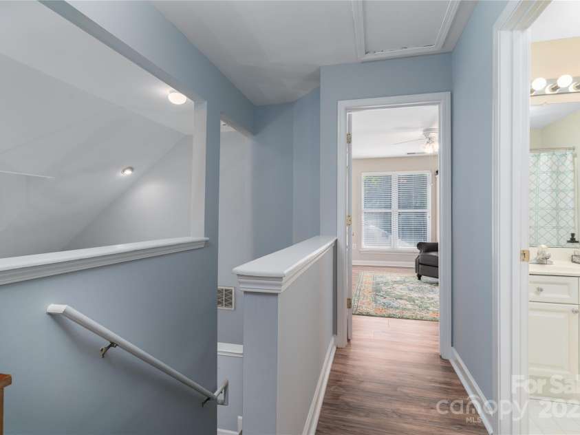 819 Northeast Drive, Davidson, NC 28036.  MLS# CAR4276218, YatesRealty ID 24193. Upstairs hallway and bedrooms have laminate flooring.