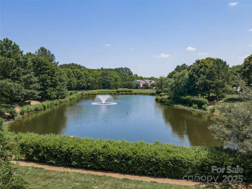 819 Northeast Drive, Davidson, NC 28036.  MLS# CAR4276218, YatesRealty ID 24193. Waling trails surround this great pond.