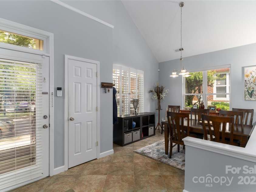819 Northeast Drive, Davidson, NC 28036.  MLS# CAR4276218, YatesRealty ID 24193. Walk out to the amazing patio from the great room.