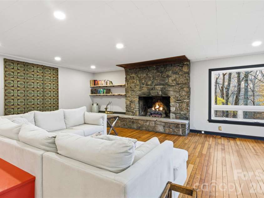 1373 Dogwood Drive, Maggie Valley, NC 28751.  MLS# CAR4320241, YatesRealty ID 2420. Beautiful Stone FP converted to gas. Mystical, picturesque surroundings.