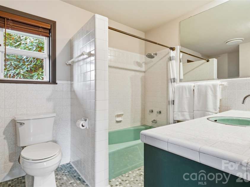 1373 Dogwood Drive, Maggie Valley, NC 28751.  MLS# CAR4320241, YatesRealty ID 2420. Period bathroom with additional plumbing-expandable