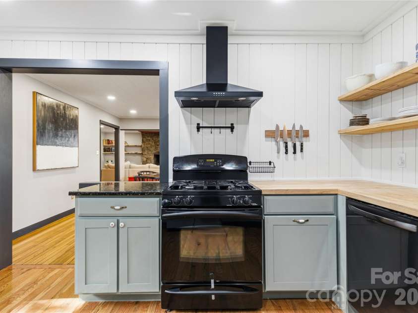 1373 Dogwood Drive, Maggie Valley, NC 28751.  MLS# CAR4320241, YatesRealty ID 2420. Vented hood, gas stove, butcher black, farmers sink