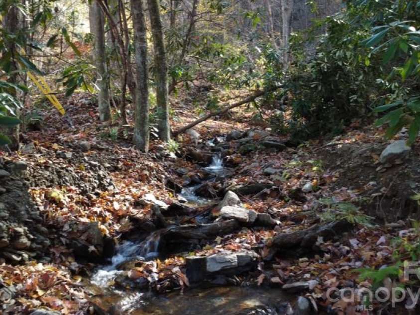 1373 Dogwood Drive, Maggie Valley, NC 28751.  MLS# CAR4320241, YatesRealty ID 2420. Your own mountian creek. with waterfalls nearby.