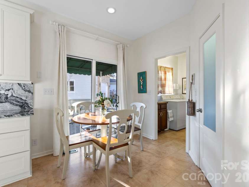 24 Country Meadows Lane, Hendersonville, NC 28792.  MLS# CAR4336584, YatesRealty ID 2420. Sunny breakfast nook with space for casual dining, located near sliding glass doors for easy access to outdoor areas