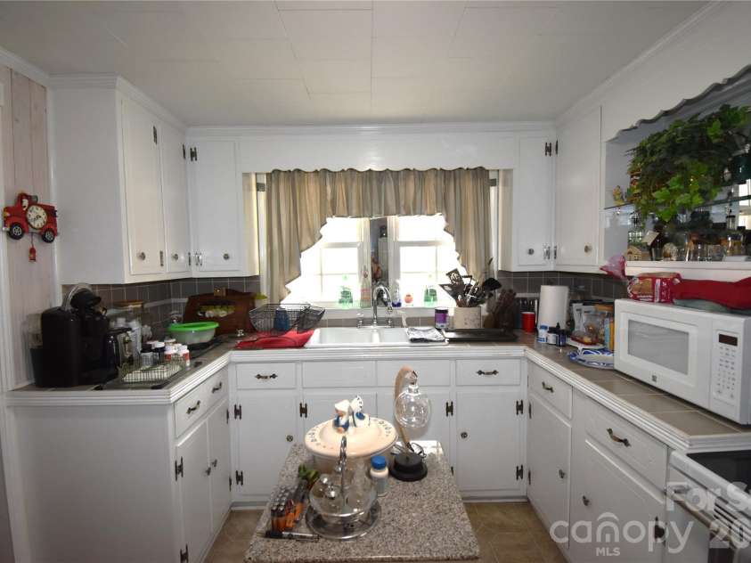 212 Sharon Avenue, Lenoir, NC 28645.  MLS# CAR4384971, YatesRealty ID 24205. 