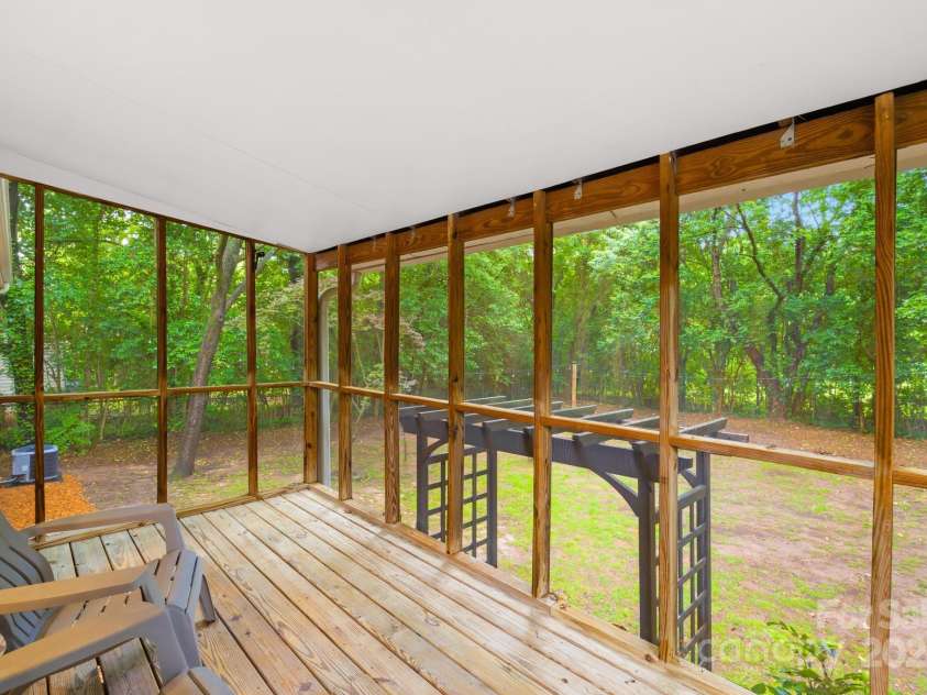4114 Stacy Boulevard, Charlotte, NC 28209.  MLS# CAR4258425, YatesRealty ID 24208. Enjoy the views of the private backyard with pergola and fire pit from your screened in back porch.