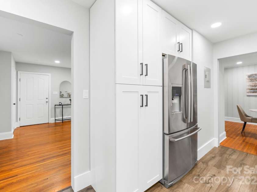 4114 Stacy Boulevard, Charlotte, NC 28209.  MLS# CAR4258425, YatesRealty ID 24208. Equipped with upgraded stainless steel appliances, the kitchen combines functionality with sleek, modern design.