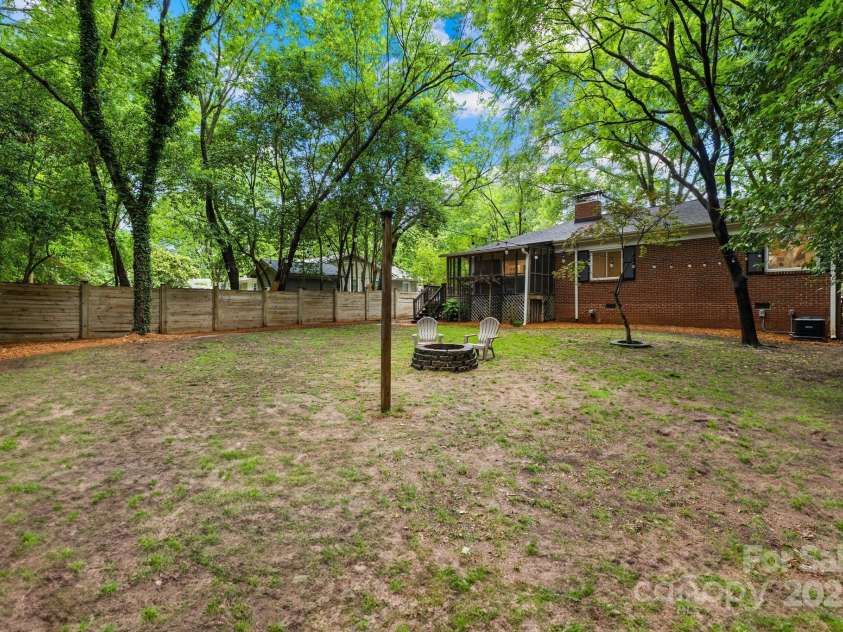 4114 Stacy Boulevard, Charlotte, NC 28209.  MLS# CAR4258425, YatesRealty ID 24208. Level and mostly fenced backyard perfect for gardening or an expansion!