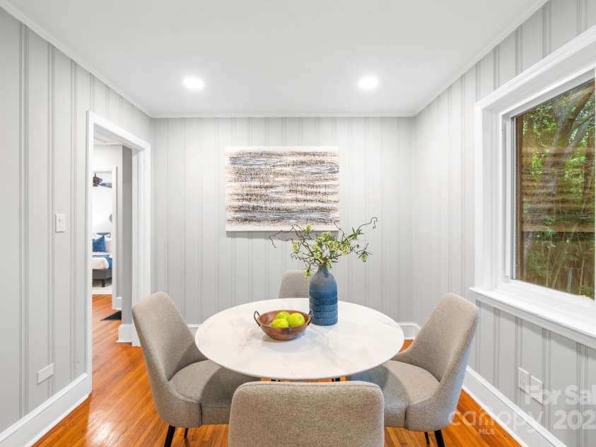 4114 Stacy Boulevard, Charlotte, NC 28209.  MLS# CAR4258425, YatesRealty ID 24208. The dining room features original hardwood floors and neutral wall tones, providing a versatile space that can also serve as a den, home office or even a third bedroom if needed.