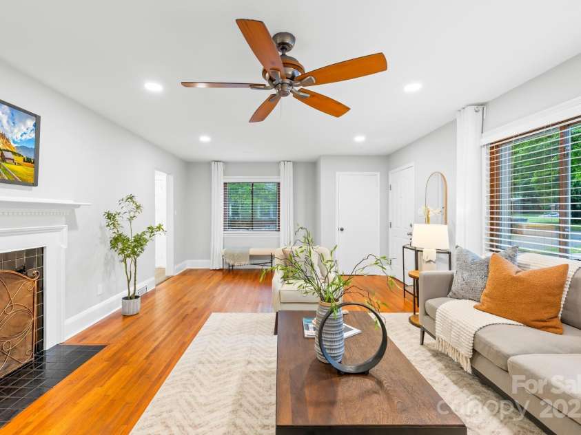 4114 Stacy Boulevard, Charlotte, NC 28209.  MLS# CAR4258425, YatesRealty ID 24208. The fireplace adds warmth and charm to the inviting living area - perfect for entertaining guests!