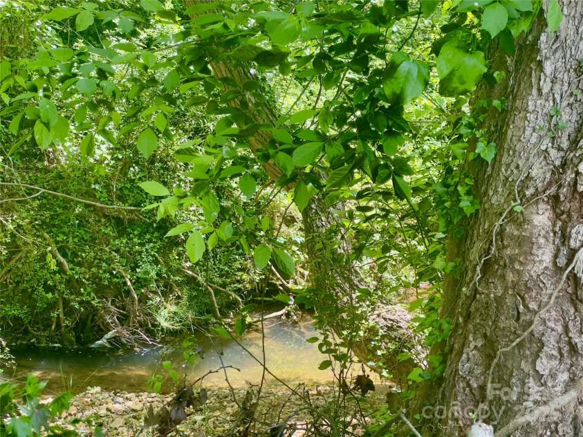 175 Spring Street, Marion, NC 28752.  MLS# CAR4253514, YatesRealty ID 24210. Creek