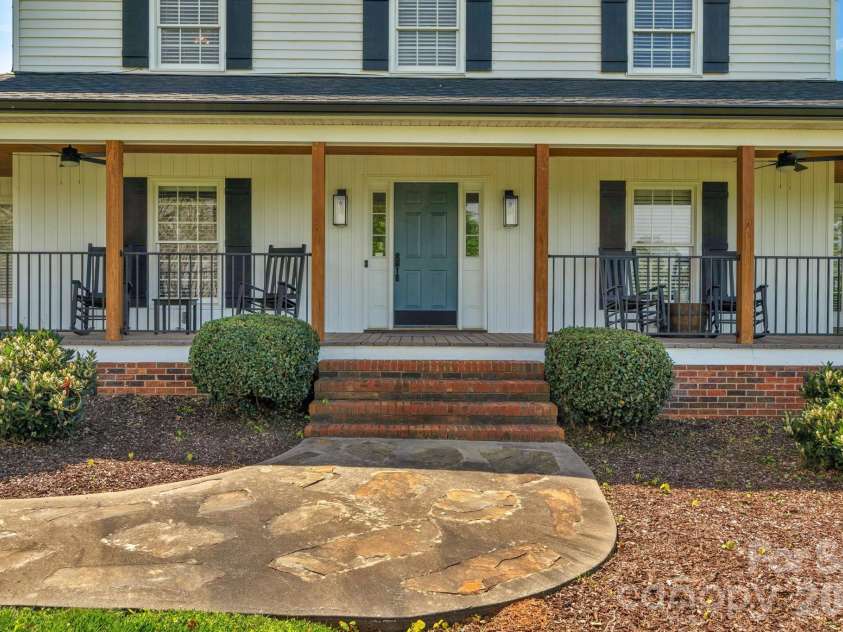 8698 Rocky River Road, Harrisburg, NC 28075.  MLS# CAR4368690, YatesRealty ID 24211. Covered front porch