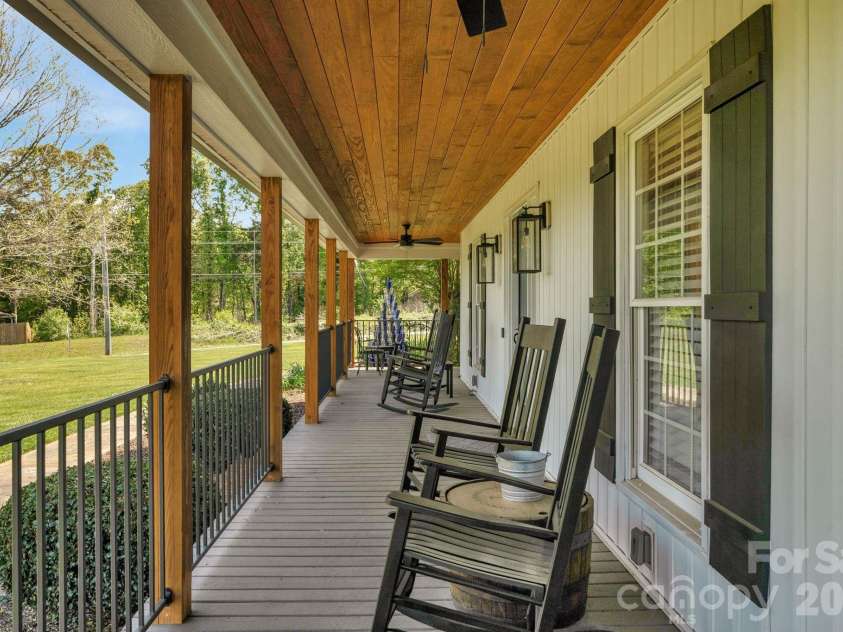 8698 Rocky River Road, Harrisburg, NC 28075.  MLS# CAR4368690, YatesRealty ID 24211. Porch seating