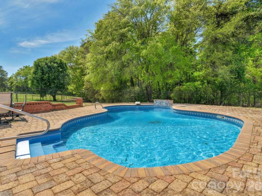 8698 Rocky River Road, Harrisburg, NC 28075.  MLS# CAR4368690, YatesRealty ID 24211. Private access from main