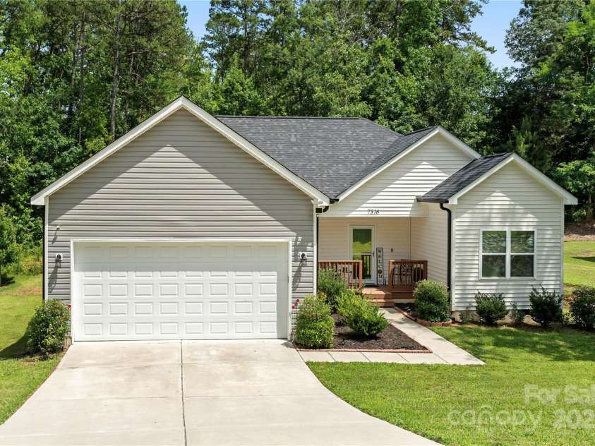 7516 O'Hara Street, Huntersville, NC 28078.  MLS# CAR4273660, YatesRealty ID 24215. Black gutters with guards