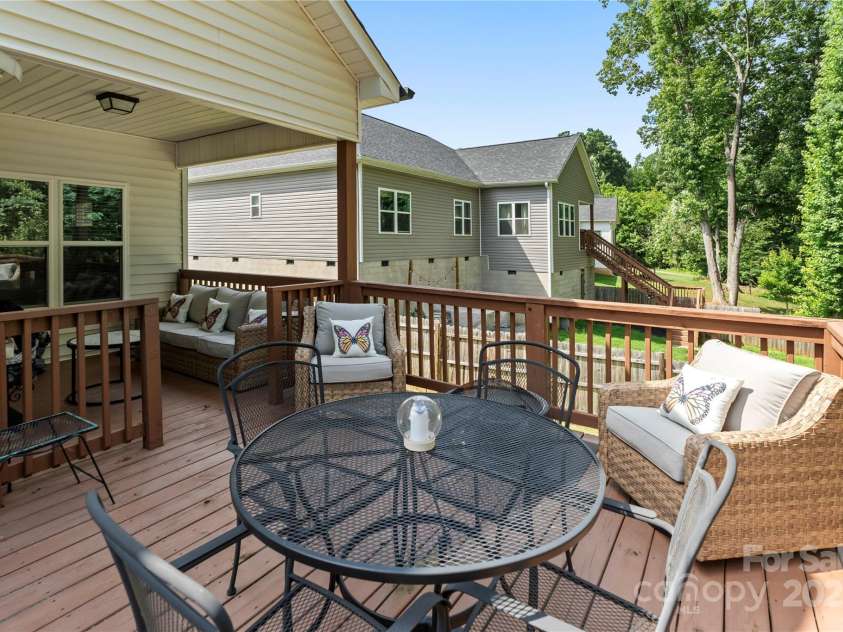 7516 O'Hara Street, Huntersville, NC 28078.  MLS# CAR4273660, YatesRealty ID 24215. Spacious deck, would be easy to screen covered porch area