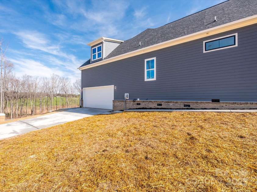 1022 Harrogate Drive, Bessemer City, NC 28016.  MLS# CAR4234331, YatesRealty ID 2422. Side load garage