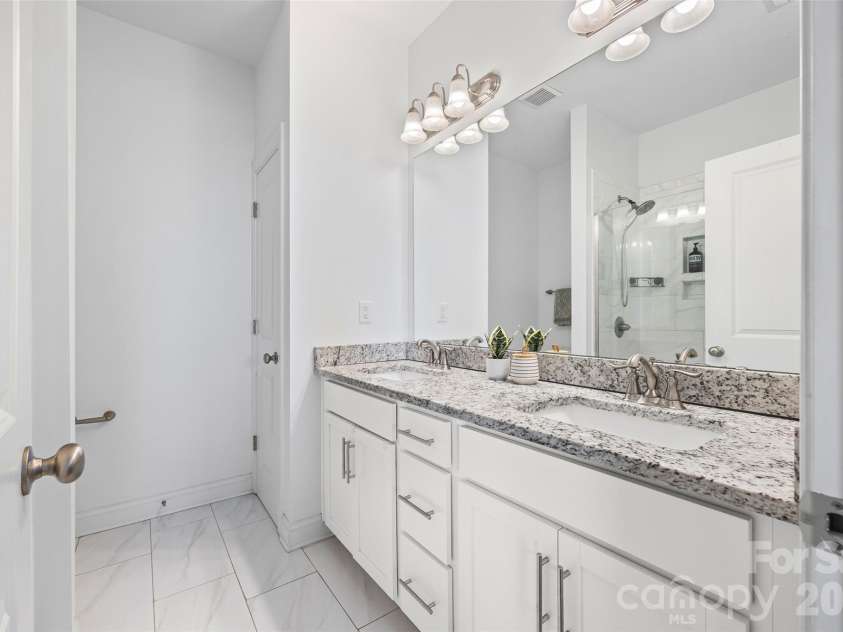 263 Keener Boulevard, Belmont, NC 28012.  MLS# CAR4341065, YatesRealty ID 24225. Primary bathroom with standing shower and linen closet