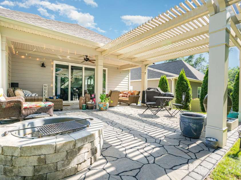 3899 Zemosa Lane, Concord, NC 28027.  MLS# CAR4275282, YatesRealty ID 24226. Firepit remains and it has a built in drain for the rainstorms. :)