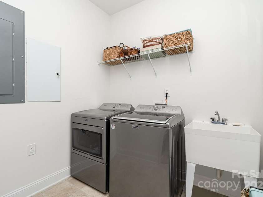 3899 Zemosa Lane, Concord, NC 28027.  MLS# CAR4275282, YatesRealty ID 24226. First floor laundry room with a utility sink.
