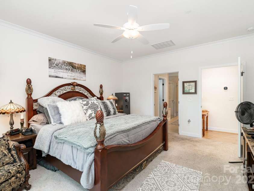 3899 Zemosa Lane, Concord, NC 28027.  MLS# CAR4275282, YatesRealty ID 24226. First floor owner's suite includes an attached deluxe bath with a large closet with a pass-through door to the laundry room.