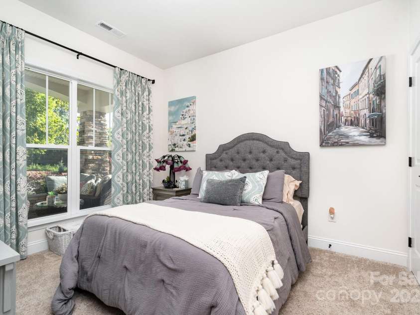 3899 Zemosa Lane, Concord, NC 28027.  MLS# CAR4275282, YatesRealty ID 24226. First floor secondary bedroom with an attached full bathroom. Great for guests or family.