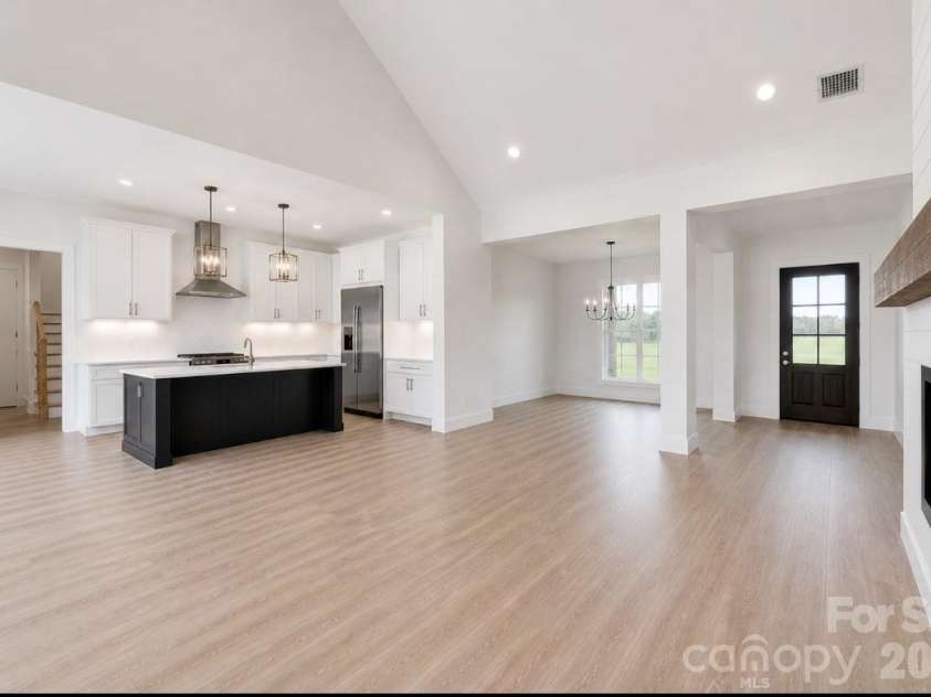 394 NC HWY 200 None, Stanfield, NC 28163.  MLS# CAR4378904, YatesRealty ID 24228. *representative photo- living room (dining room option of plan), optional vaulted ceiling