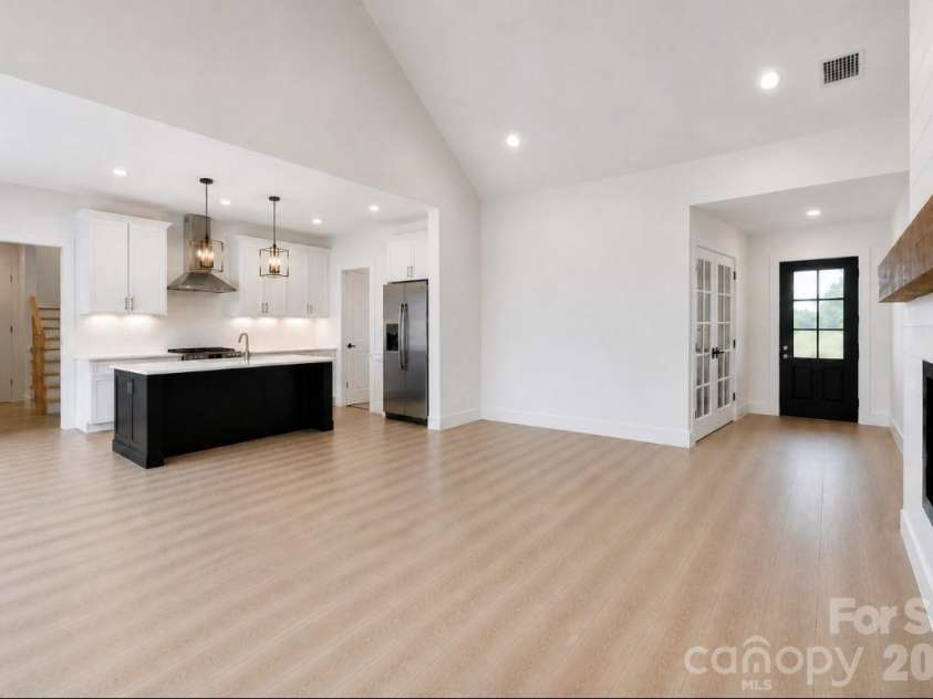 394 NC HWY 200 None, Stanfield, NC 28163.  MLS# CAR4378904, YatesRealty ID 24228. *representative photo- living room (office version of plan), optional vaulted ceiling