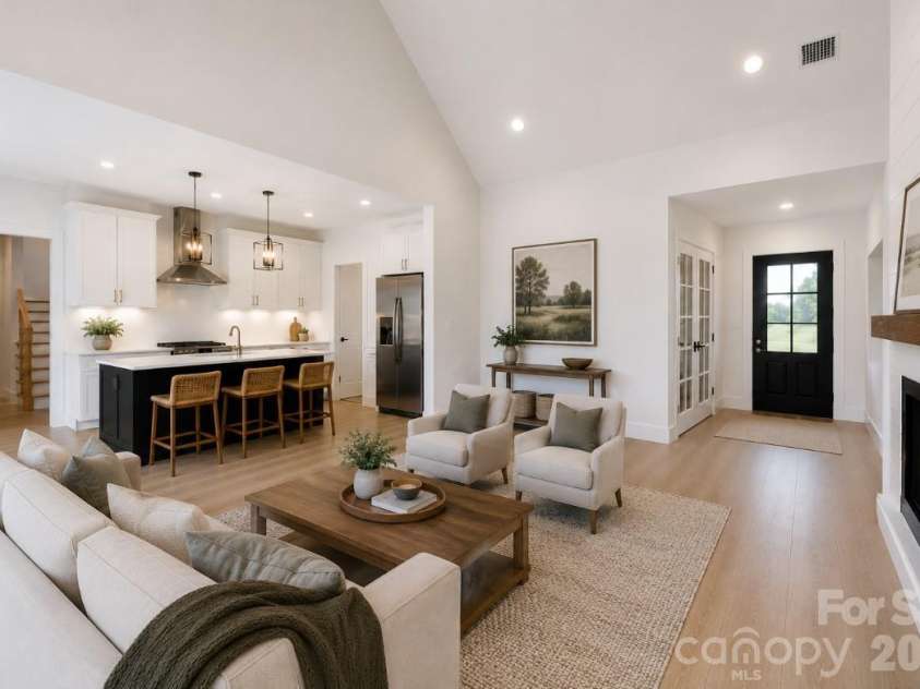 394 NC HWY 200 None, Stanfield, NC 28163.  MLS# CAR4378904, YatesRealty ID 24228. *representative photo- staged living room (office version of plan), optional vaulted ceiling